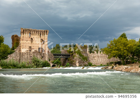 Borghetto Scaligeri Castle waterfalls in the village of Valeggio sul Mincio in Verona Italy. Borghetto Scaligeri Castle waterfalls in the village of Valeggio sul Mincio in Verona Italy. 94695356