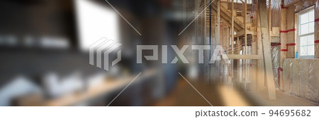 Blurred image of empty corporate office and wooden structures at construction site Blurred image of empty corporate office and wooden structures at construction site 94695682