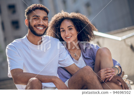 Smiling and happy young couple spending time together Smiling and happy young couple spending time together 94696502