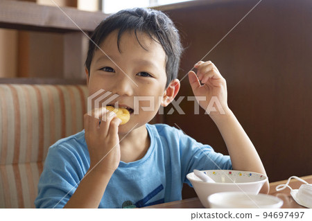 boy eating delicious food 94697497