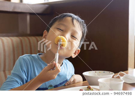 boy eating delicious food 94697498