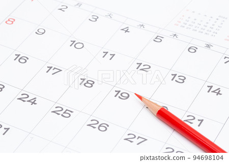 Calendar and red pencil 94698104