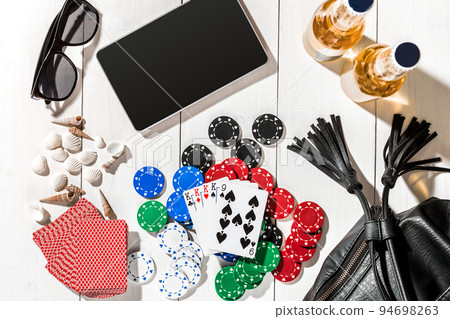 Poker. Set to playing poker with cards and chips on white wooden table, top view Poker. Set to playing poker with cards and chips on white wooden table, top view 94698263