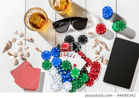 Poker. Set to playing poker with cards and chips on white wooden table, top view Poker. Set to playing poker with cards and chips on white wooden table, top view 94698342