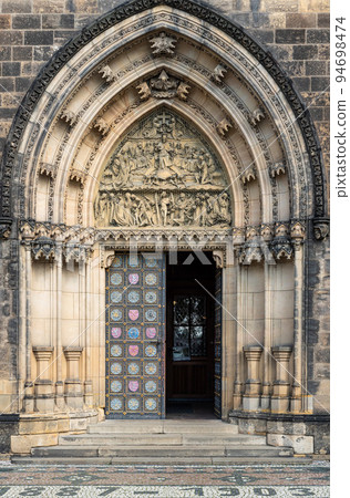 Prague - Czech Republic - Decorated arched doorway of the Saint Peter and Paul Basilica 94698474