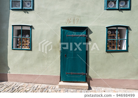 Prague - Czech Republic - Facade of a traditional green house in the Golden Lane Prague - Czech Republic - Facade of a traditional green house in the Golden Lane 94698499