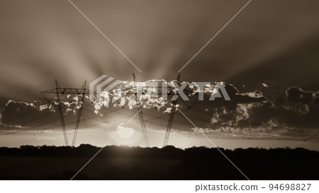 High voltage power line at sunset, Pampas, Argentina 94698827