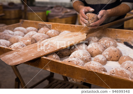 yeast dough in the form of loaves waiting to be cooked 94699348