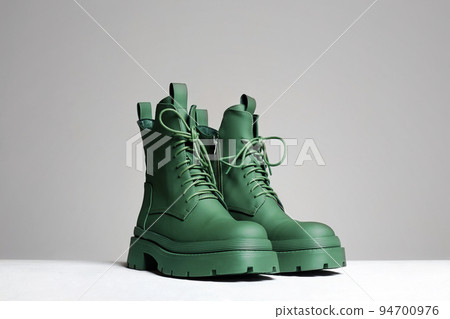 shoes. fashion still life. stylish green boots 94700976