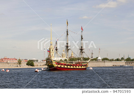 A replica of the wooden "Petrovsky" battleship "Poltava" at the parade on the Day of the Navy against the backdrop of the Peter and Paul Fortress. St. Petersburg. Russia 94701593