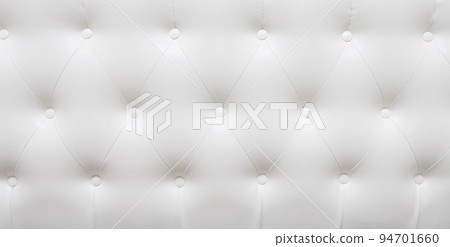 Beautiful white leather upholstery sofa with buttons. Skin texture. Beautiful white leather upholstery sofa with buttons. Skin texture. 94701660