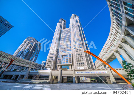 Tokyo cityscape in Japan Looking at the Tokyo Metropolitan Government Building in the strong sunlight in the morning 94702494