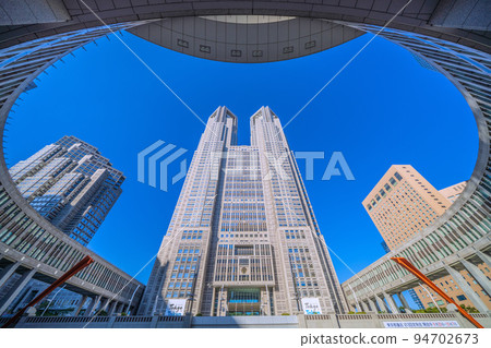Tokyo cityscape in Japan Tokyo Metropolitan Government Building. A view of the Tokyo Metropolitan Government No. 1 Main Building, bathed in the strong morning sun 94702673