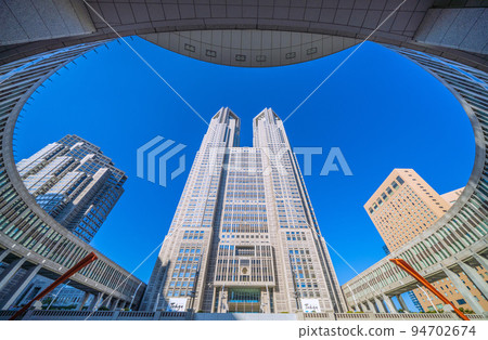 Tokyo cityscape in Japan Tokyo Metropolitan Government Building. A view of the Tokyo Metropolitan Government No. 1 Main Building, bathed in the strong morning sun 94702674