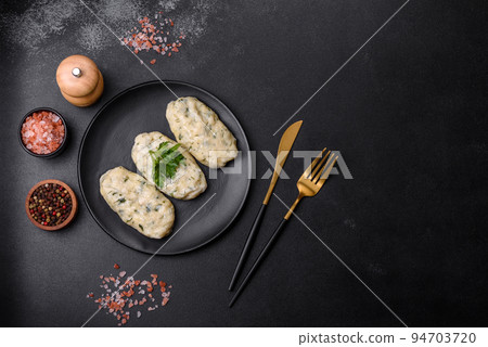 Traditional Lithuanian dish zeppelin, boiled potato dumplings stuffed with minced meat Traditional Lithuanian dish zeppelin, boiled potato dumplings stuffed with minced meat 94703720