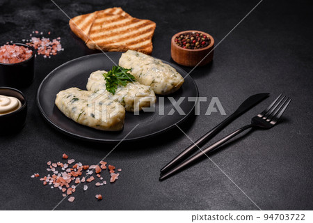 Traditional Lithuanian dish zeppelin, boiled potato dumplings stuffed with minced meat 94703722