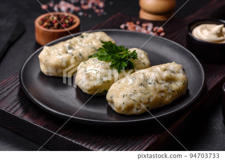 Traditional Lithuanian dish zeppelin, boiled potato dumplings stuffed with minced meat 94703733