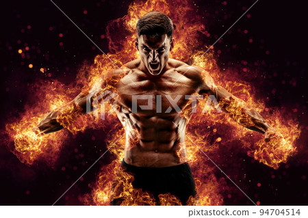 Bodybuilder posing on the fire flames background Bodybuilder posing on the fire flames background 94704514