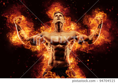 Bodybuilder posing on the fire flames background Bodybuilder posing on the fire flames background 94704515