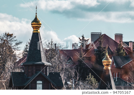 Gold dome with cross on wooden church top scenic Gold dome with cross on wooden church top scenic 94705167