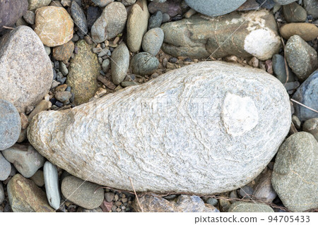 Stones with various patterns found on the river bed Stones with various patterns found on the river bed 94705433