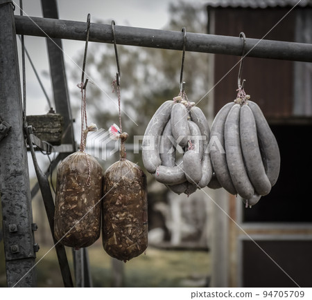 Handmade pork sausages, hung drying in fresh air 94705709