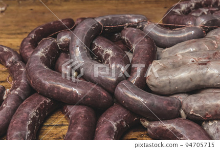 Handmade pork sausages finished on the table. Handmade pork sausages finished on the table. 94705715