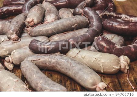 Handmade pork sausages finished on the table. Handmade pork sausages finished on the table. 94705716
