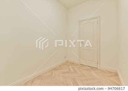 Plastic window and radiator on white wall in empty light room at home Plastic window and radiator on white wall in empty light room at home 94706617