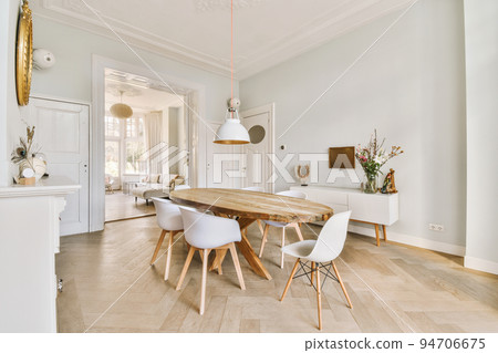 Modern dining room in a luxury house with beautiful design Modern dining room in a luxury house with beautiful design 94706675