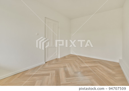 Plastic window and radiator on white wall in empty light room at home Plastic window and radiator on white wall in empty light room at home 94707509