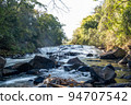 A mountain stream waterfall shot from downstream with a slow shutter speed 5 94707542