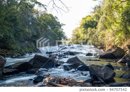 A mountain stream waterfall shot from downstream with a slow shutter speed 5 A mountain stream waterfall shot from downstream with a slow shutter speed 5 94707542