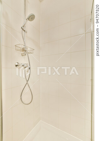 Interior of contemporary bathroom with shower and sink in minimal style flat 94707820