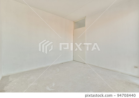 Interior of empty white room with large balcony windows with curtains and wooden parquet floor Interior of empty white room with large balcony windows with curtains and wooden parquet floor 94708440