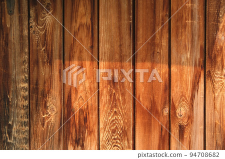 The texture of an old fence with a shadow. Wood The texture of an old fence with a shadow. Wood 94708682