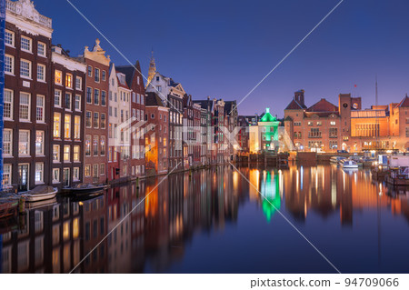 Amsterdam, Netherlands in Damrak at Night 94709066