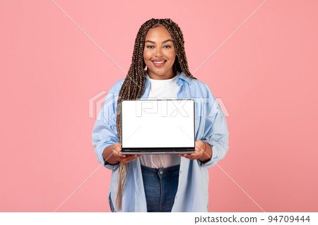 African American Lady Showing Laptop Empty Screen Over Pink Background African American Lady Showing Laptop Empty Screen Over Pink Background 94709444