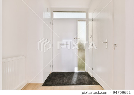 Corridor of contemporary apartment and doorway leading to terrace Corridor of contemporary apartment and doorway leading to terrace 94709691