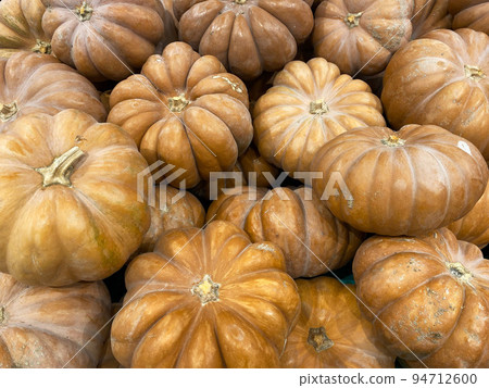 Close-up of pumpkins at the bazaar. Background. Texture. 94712600
