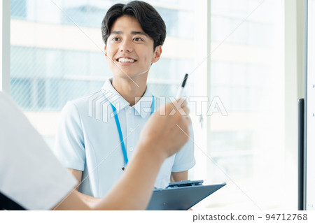 Caregiver man having a meeting Caregiver man having a meeting 94712768