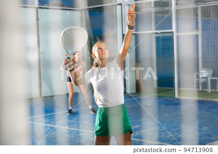 Padel tennis teenage girl in court ready for play 94713908
