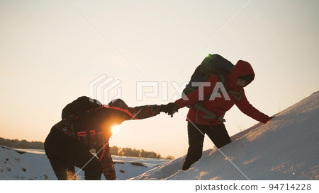 teamwork silhouette. handshake comrades rejoicing victory. shake hands command group mountain hill sunset. overcome difficulties. top cliff goal climbers. trekking snowy winter hike happy successful. teamwork silhouette. handshake comrades rejoicing victory. shake hands command group mountain hill sunset. overcome difficulties. top cliff goal climbers. trekking snowy winter hike happy successful. 94714228