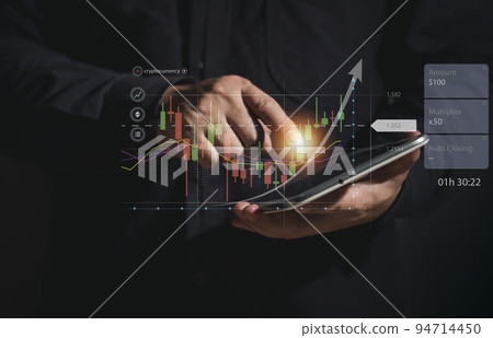Businessman using tablet Concept of using graphs to analyze stock purchase decisions. Cryptocurrency Ideas for trading bitcoin stocks. 94714450