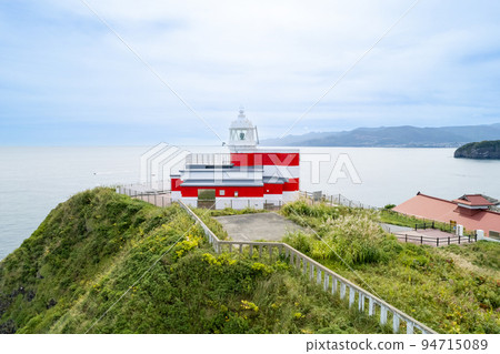 Hiyoriyama Lighthouse with beautiful red and white standing at the tip of a steep cliff | Otaru City, Hokkaido Hiyoriyama Lighthouse with beautiful red and white standing at the tip of a steep cliff | Otaru City, Hokkaido 94715089