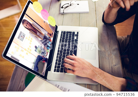 Caucasian businessman sitting at desk using laptop having video call with female colleague 94715536