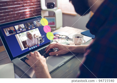 Caucasian businessman sitting at desk using laptop having video call with group of colleagues 94715540