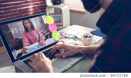 Caucasian man having video call with coworker Caucasian man having video call with coworker 94715799