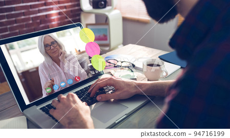 Caucasian businessman sitting at desk using laptop having video call with female colleague 94716199