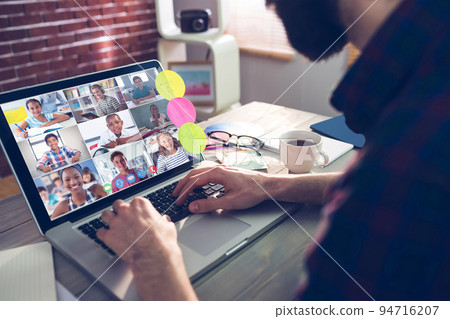 Caucasian businessman sitting at desk using laptop having video call 94716207